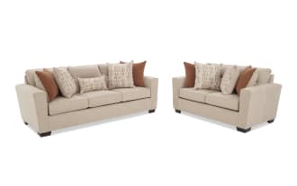 Beige fabric sofa with dark wooden legs, featuring three seat cushions and six decorative pillows in rust and patterned beige tones, shown from front and side angles.