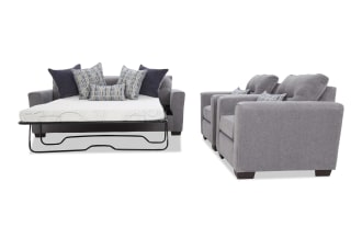 Gray fabric sofa bed with metal frame mattress pull-out, paired with two matching gray fabric armchairs, featuring patterned and solid throw pillows.