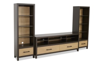 Modern entertainment center with dark brown frame and light wood paneling, featuring two tall shelving units, multiple shelves, and drawers for storage.