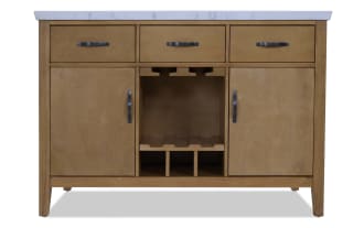 Wooden bathroom vanity with a white marble countertop, featuring three top drawers, two side cabinets, and a central wine rack storage area.