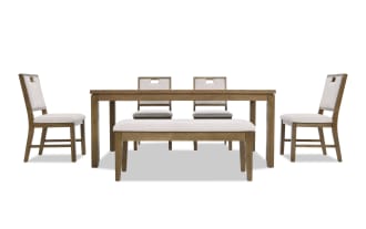 Dining set with a rectangular wooden table, four beige upholstered chairs with wooden frames, and a matching upholstered bench.