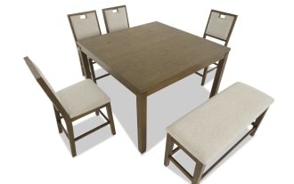 Dining set with a rectangular wooden table, four beige upholstered chairs, and a matching bench with cushioned seat, featuring a modern rustic design.