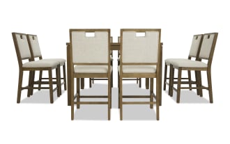 Dining set with eight wooden chairs featuring beige upholstered seats and backs, arranged around a rectangular wooden table.