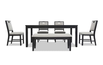 Dining set with a black wood rectangular table, four chairs with light gray cushioned seats and backs, and a matching cushioned bench.