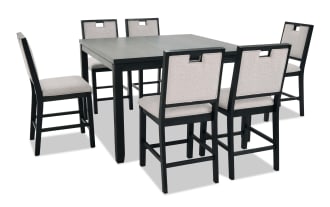 Black wooden dining table set with six beige upholstered chairs, featuring a modern design with square table and cushioned seats, ideal for dining rooms.