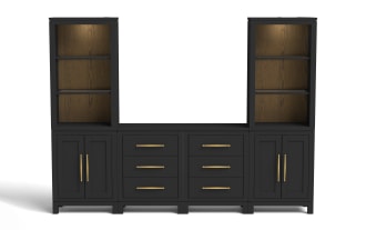 Black wooden entertainment center with two tall open shelves featuring warm wood back panels and built-in lighting, four drawers with gold handles, and two closed cabinets with gold vertical handles, designed for living room storage and media organization.