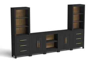 Black wooden entertainment center with matte finish, featuring two tall open shelving units with warm wood back panels, three drawers with gold handles on each side, two double-door cabinets with gold vertical handles, and a central open shelf area, designed for living room storage and media organization.