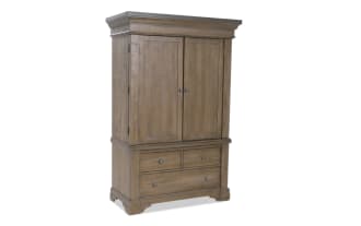 Rustic wooden armoire with two paneled doors and three drawers, featuring metal knobs and a natural brown finish, ideal for bedroom storage.
