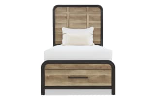Twin bed with rustic wood panel headboard and footboard, black metal frame, white mattress, and decorative white pillows.