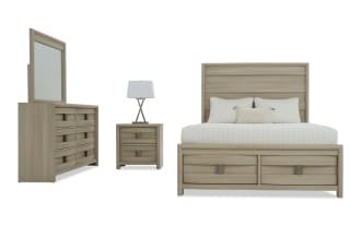 Modern bedroom set featuring a light oak wood finish with a king-size bed, matching dresser with mirror, and two-drawer nightstand with lamp.