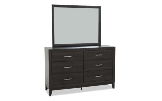 Dark wood dresser with six drawers and silver handles, topped with a matching rectangular mirror, featuring a modern, sleek design.