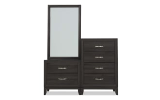 Dark wood dresser set with a tall mirror, featuring two large drawers on the left and four smaller drawers on the right, modern metal handles.