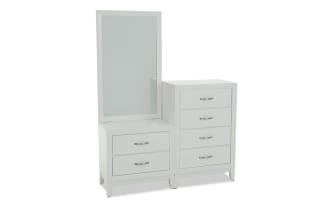 White modern dresser with a tall mirror on the left side and two drawers below it, paired with a four-drawer chest on the right, featuring sleek metal handles and a minimalist design.