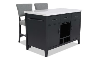 Black kitchen island with white marble countertop, featuring three drawers, two cabinets, wine rack, and two gray upholstered chairs.