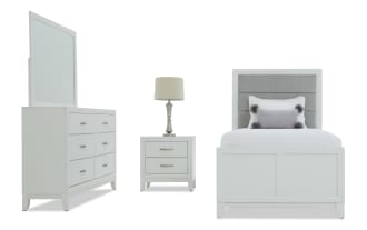 White bedroom furniture set including a twin bed with gray upholstered headboard, white nightstand with metal handles and lamp, and matching dresser with mirror.