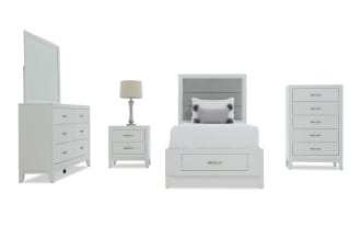 White bedroom furniture set including a dresser with mirror, nightstand with lamp, upholstered headboard bed with storage drawer, and chest of drawers, featuring modern silver handles and a clean, minimalist design.
