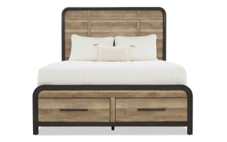 Queen-size bed with rustic wood panel headboard and footboard, black metal frame accents, and two storage drawers, styled with white bedding and pillows.