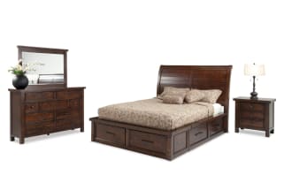 Hudson 4 Piece King Pecan Storage Platform Bedroom Set with transitional sleigh bed, six storage drawers, dresser with mirror, and nightstand with USB ports. Made from rubberwood, pine solids, MDF, mango veneers, and pewter hardware in warm pecan finish.