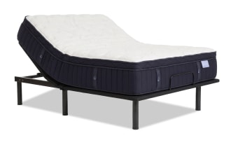 Adjustable bed frame with black metal legs and a dark navy blue mattress featuring a white quilted top, designed for customizable comfort and support.