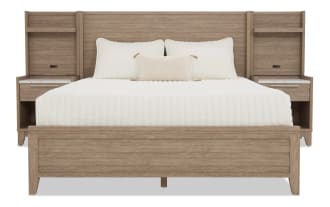 King-size wooden bed frame with integrated nightstands, light oak finish, white bedding, and modern minimalist design.
