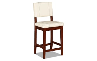 Naples Cream transitional counter height stool with cream faux leather polyurethane upholstery, solid rubberwood frame, and stain-resistant vinyl cushion.