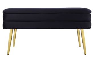 Contemporary Astrid Black Storage Bench with plush black velvet upholstery, channel-tufted seat, and polished gold metal legs for stylish seating and storage.