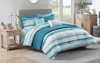 Lucas King California King Aqua 8 Piece Comforter Set in coastal style with white, aqua, and teal microfiber fabric, featuring striped and solid patterns and an extra lightweight blanket.