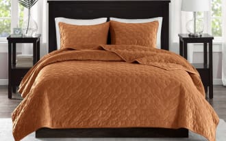Camille King/California Orange Geometric 3 Piece Quilt Set in rich orange polyester velvet with geometric quilted design and matching shams for a glam bedroom style.