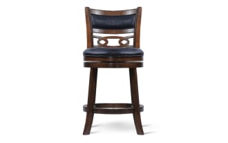 Set of two wooden bar stools with dark brown finish, black cushioned leather seats and backs, featuring decorative cutout design and footrests.