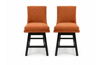 Set of two modern dining chairs with burnt orange upholstered fabric seats and backs, featuring black wooden legs and crossbars for support.