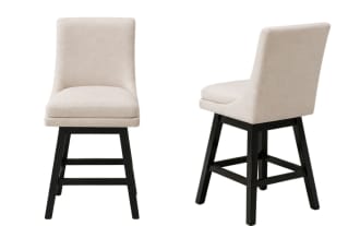 Pair of modern swivel dining chairs with cream-colored upholstered seats and backs, featuring black wooden legs and footrests.