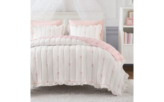 Maison Full/Queen Pink 3 Piece Quilt Set with white microfiber, pink bow embroidery, ruffled edges, and down-alternative fill for cozy, stylish bedding.