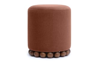Addyson Orange/Brown Ottoman with plush polyester fabric upholstery, contemporary style, and distinctive solid rubberwood orb base for seating or footrest.
