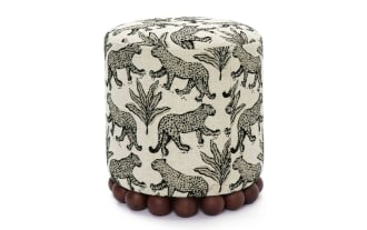 Addyson Cream Leopard Ottoman with black leopard print on cream polyester fabric, contemporary style, solid rubberwood orb base, tan upholstery.