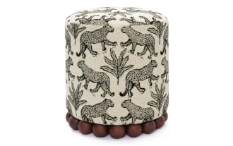 Addyson Cream Leopard Ottoman with black leopard print on cream polyester fabric, contemporary style, solid rubberwood orb base, tan upholstery.