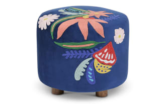 Garren Blue Embroidered Ottoman with vibrant blue polyester velvet fabric, multicolored floral embroidery, round cottage style, hardwood frame, and mango wood legs.