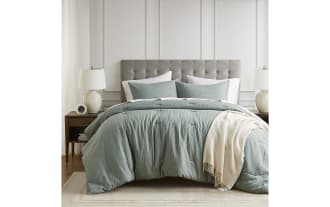 Anna Twin/Twin XL Green Solid 2 Piece Comforter Set with waffle-weave texture, light green polyester fabric, and plush, lightweight filling for year-round comfort.