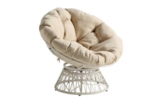 Round papasan chair with a beige, tufted cushion and a white woven rattan base, designed for comfortable indoor or outdoor seating.