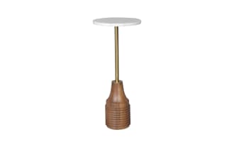 Modern side table with a round white marble top, supported by a slim brass rod and a carved wooden base in natural brown finish.