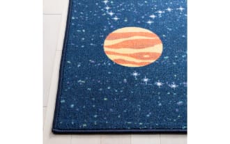 Navy blue Orbit Adventure 3' square rug with yellow sun, colorful planets, and rockets in a playful transitional style. Durable polyamide fabric.
