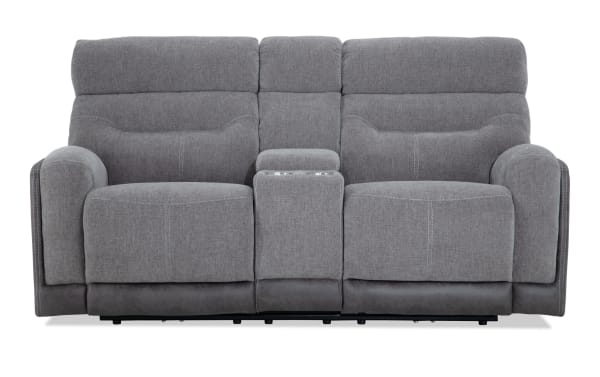 Phantom Gray 76'' manual reclining console loveseat in gray polyester fabric, transitional style with built-in center console and memory foam cushions.