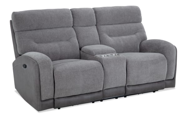 Phantom Gray 76" transitional manual reclining console loveseat in gray polyester fabric with built-in cup holders and memory foam cushions.
