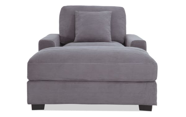 Aspen Charcoal Chaise in gray polyester fabric with plush cushioning, transitional style, and included accent pillow for cozy lounging.