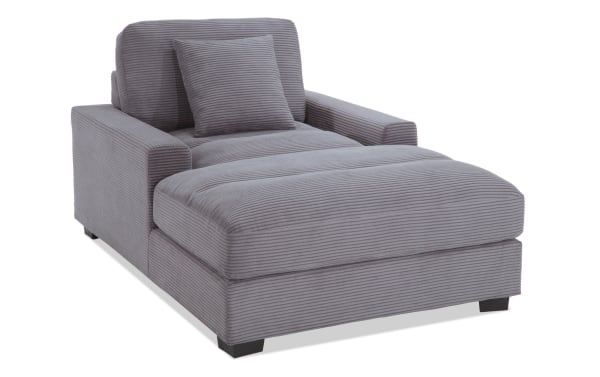 Aspen Charcoal Chaise in gray polyester fabric with plush cushioned seat, transitional style, and included accent pillow for comfortable lounging.