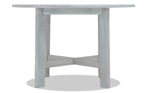 Mango White solid wood round dining table in contemporary style with thick legs and crossbeam support from Mango Dining collection.