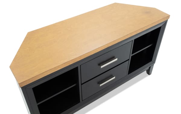 Wood and black two-drawer sideboard with open shelves on each side, featuring silver handles and angled wooden top surface.