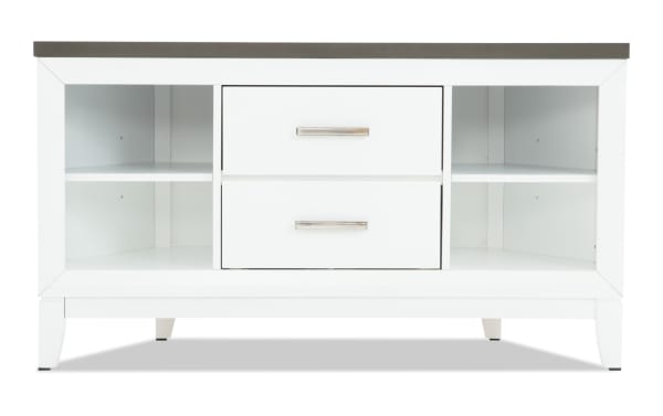 White wooden TV stand with two central drawers featuring silver handles, open shelving on both sides, and a dark wood top surface.