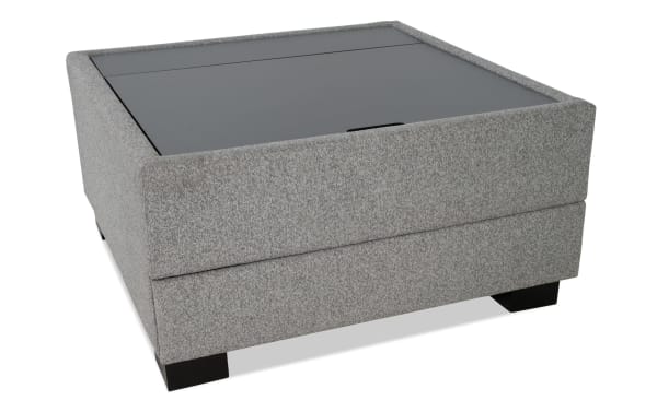 Gray Playday Gray Upholstered Lift-Top Square Tray Table Ottoman with polyester fabric, MDF, metal, hidden storage, wheels, and compact stools.