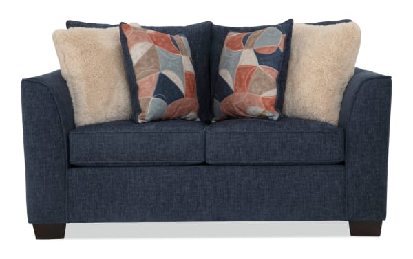 Brynn Navy 64'' Loveseat in transitional style with navy polyester fabric upholstery, Bob-O-Pedic memory foam cushions, and decorative accent pillows.
