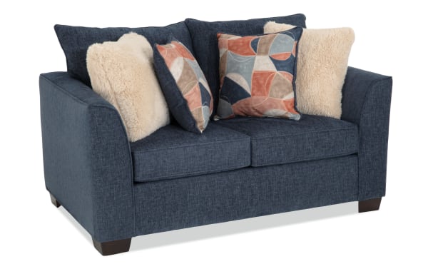 Brynn Navy 64'' Loveseat in transitional style with navy polyester fabric upholstery, memory foam cushions, and assorted plush accent pillows.